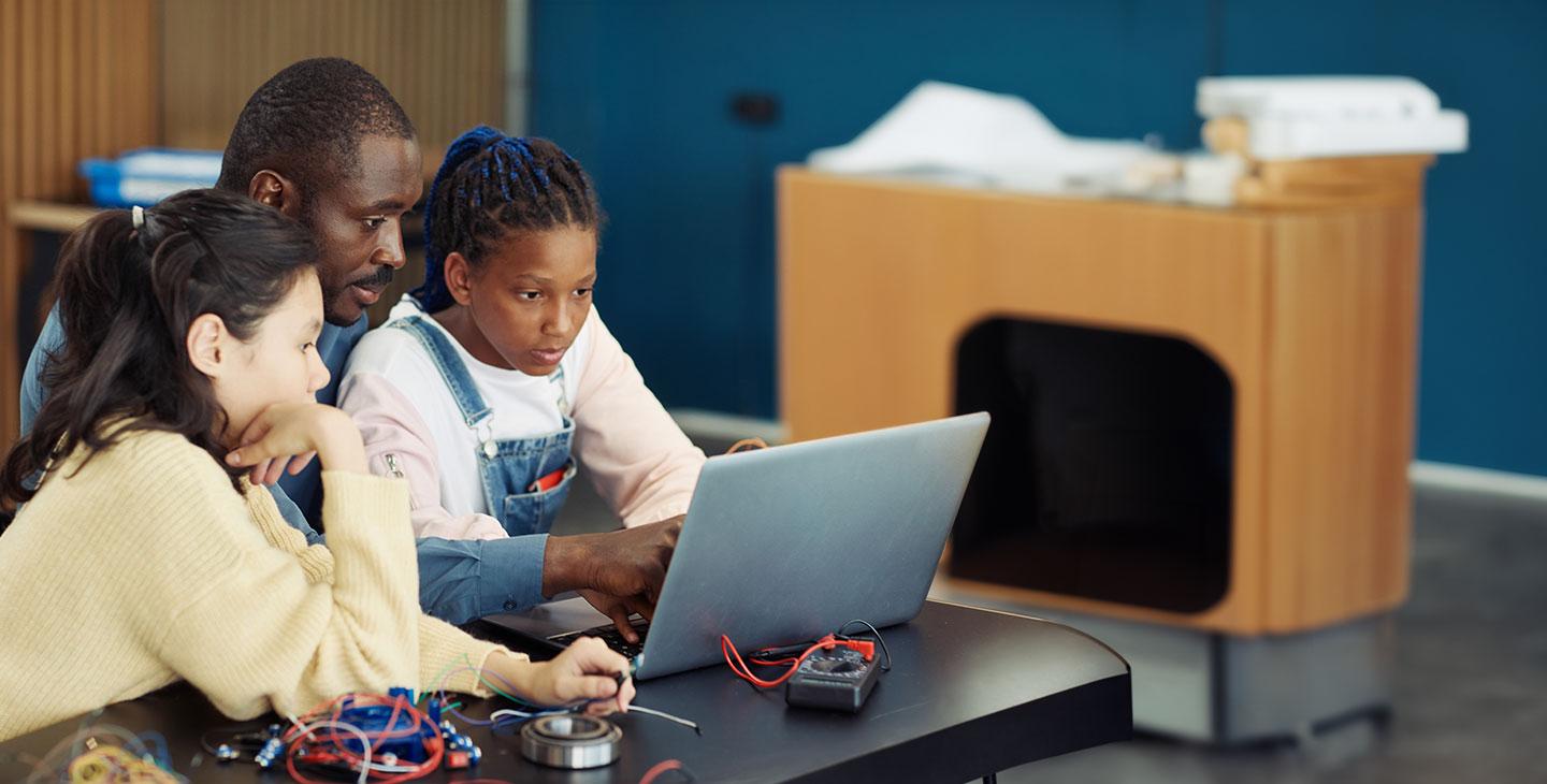 A Viasat volunteer  helping bridge the digital divide by connecting schoolchildren with online educational resources